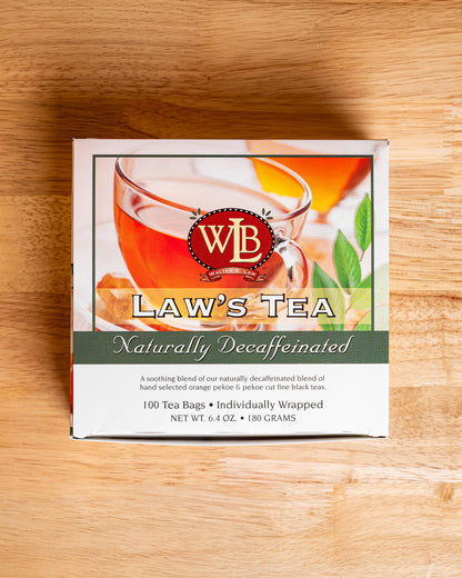 A box of Law's Naturally Decaffeinated Tea Bags with a picture of a cup of tea and orange pekoe on the front.