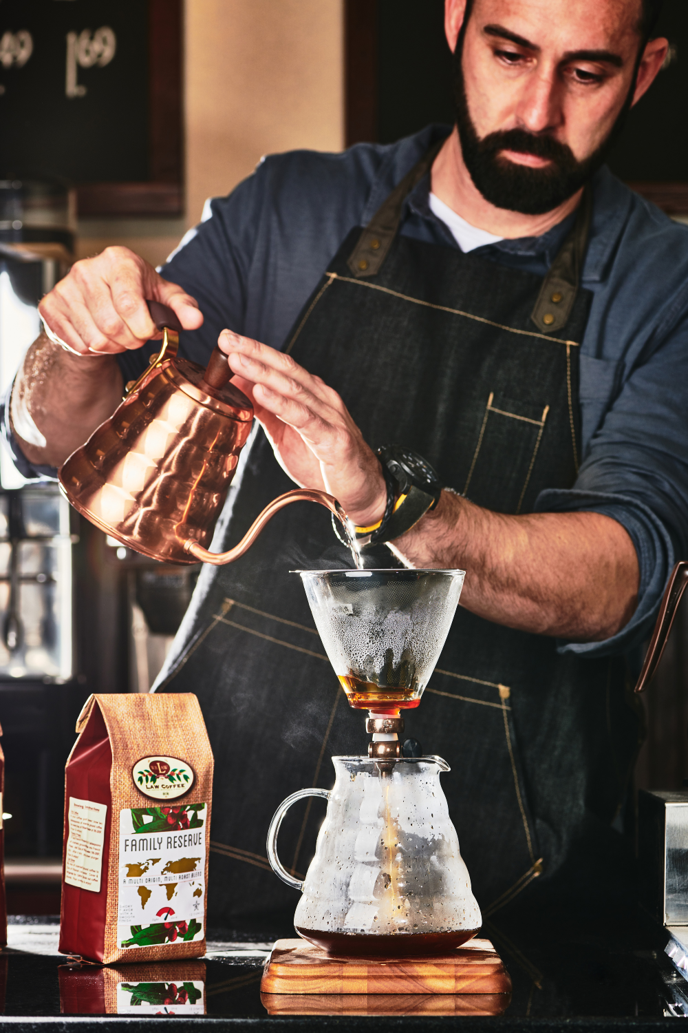 David Mendez hand pouring a pot of coffee.