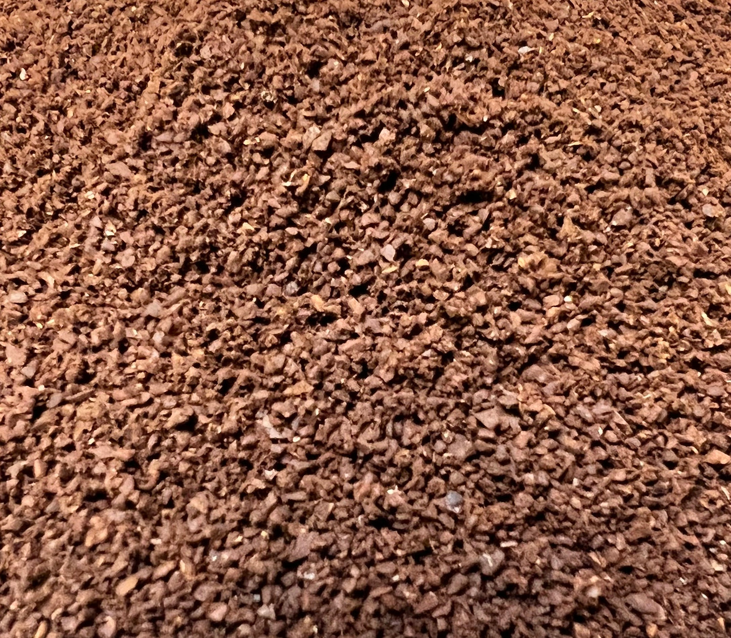 pile of roasted and ground coffee