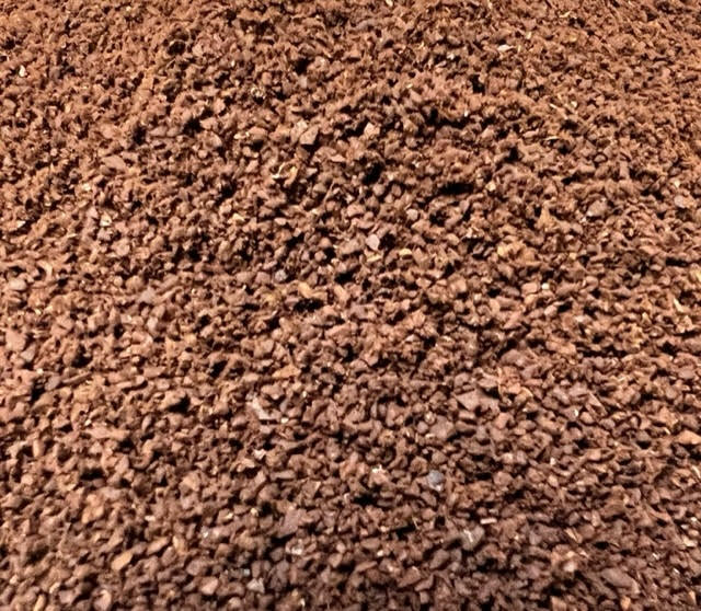 a pile of ground roasted coffee.